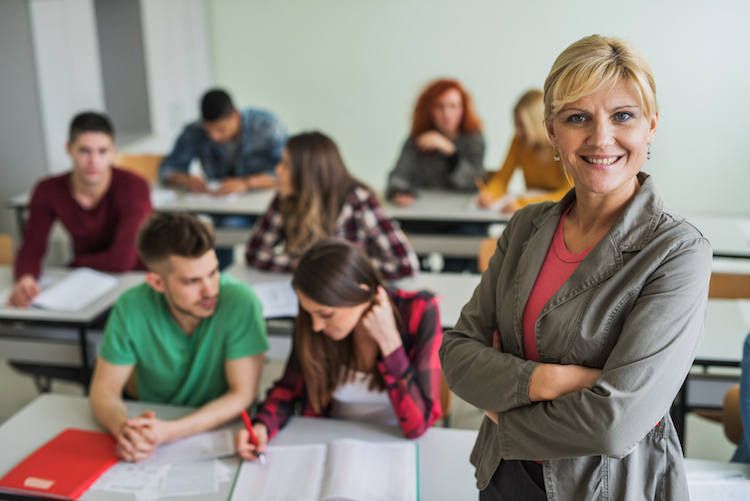 professor in classroom with student