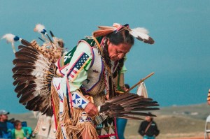 Native American man dancing in traditional garb