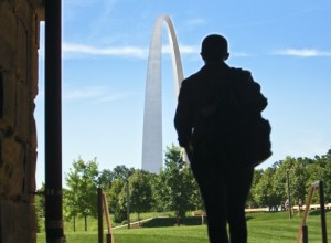silhouette of person walking toward st louis arch