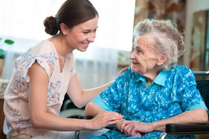 A nurse helps an assisted living home