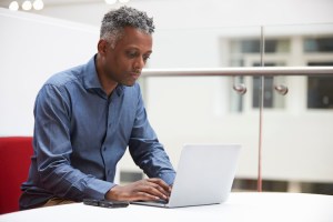 middle aged student on laptop