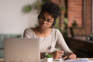 A student attends a class at an online university in Missouri.