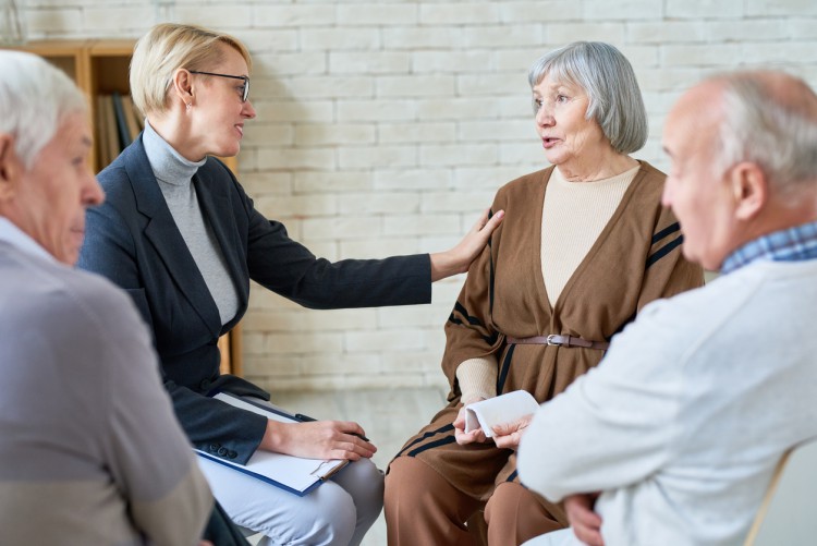 Social services worker meets with clients.