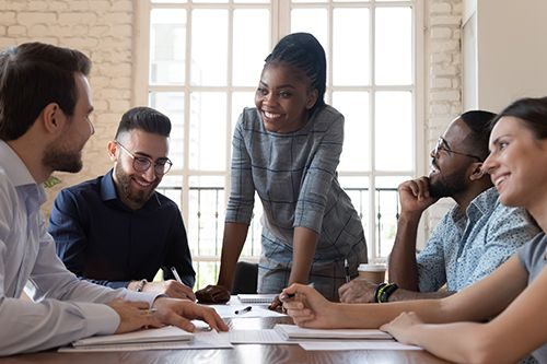 female leader listening to colleagues project ideas