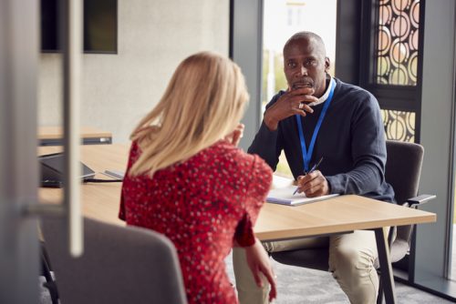 A counselor trained in forensic psychology conducts an interview.