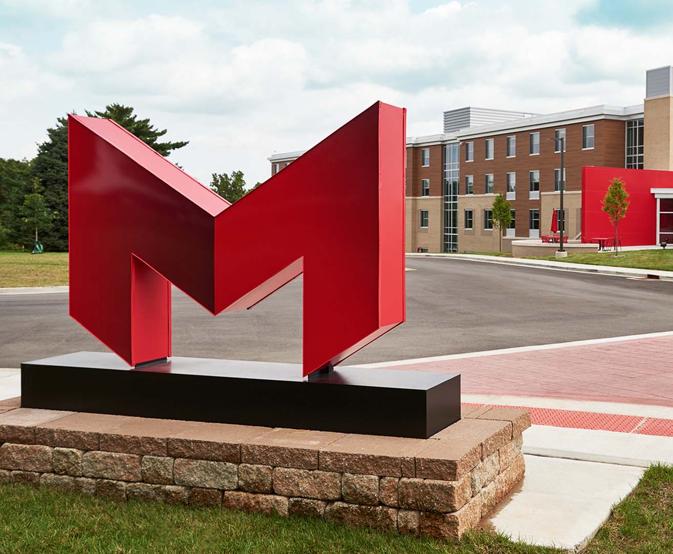 A large red letter m in front of Maryville University.
