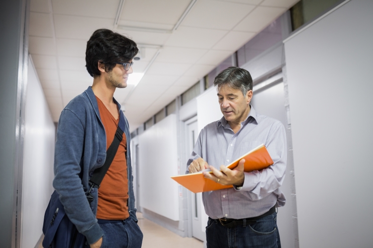 University registrar speaking with a student.