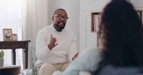 A counselor talks with a client.