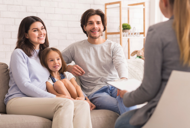 A family support worker meets with clients.