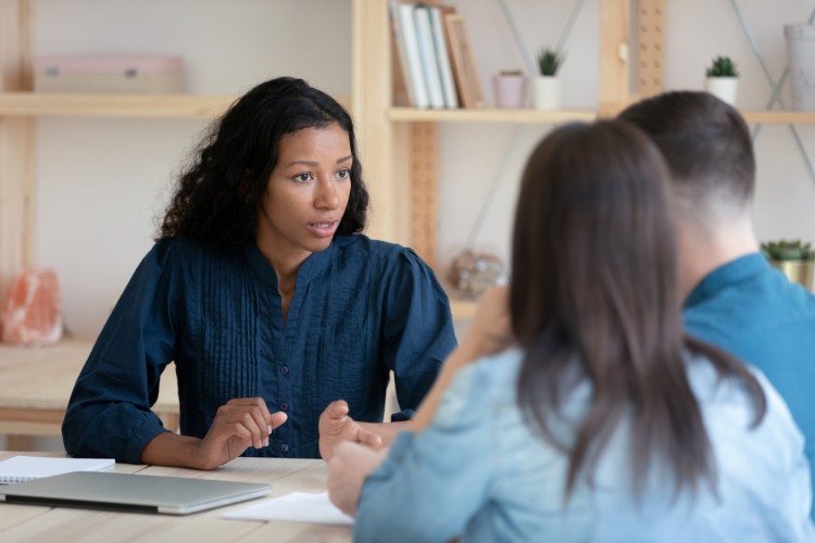 A human rights officer meets with clients.