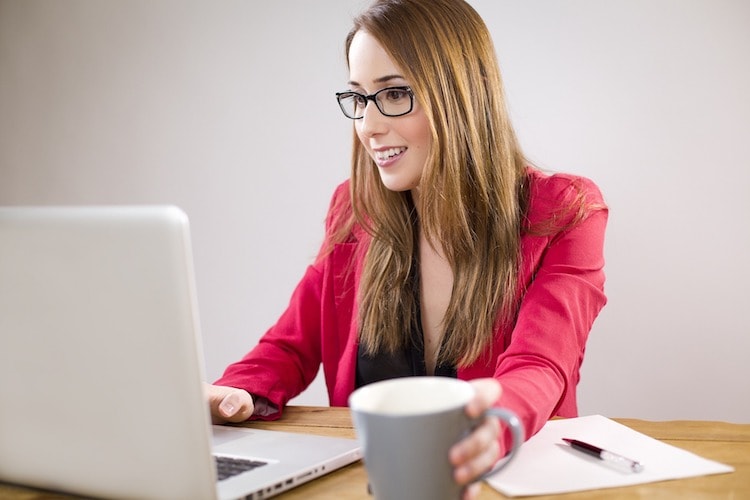 woman analyzing data using a laptop