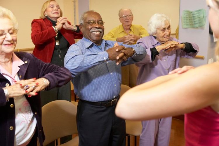 Nursing home residents in a stretching class
