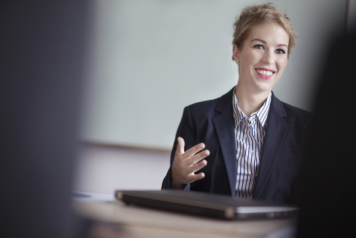 Business student speaking in a group session.