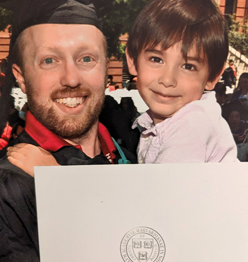 Zacharias at his graduation with his son in arms. 