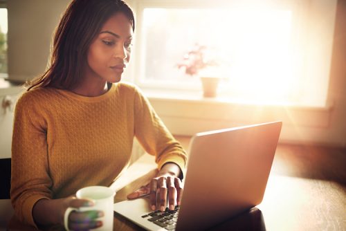 adult student working on laptop