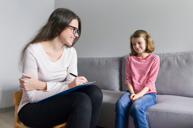 Female development psychologist with a  patient.